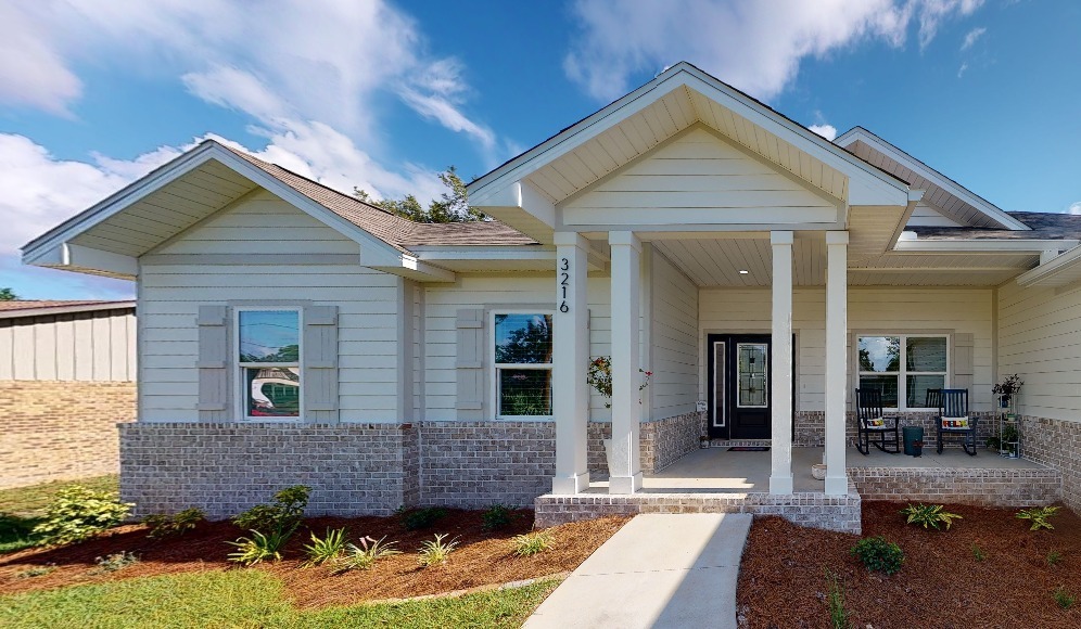 Modern spec home exterior in a Pensacola neighborhood