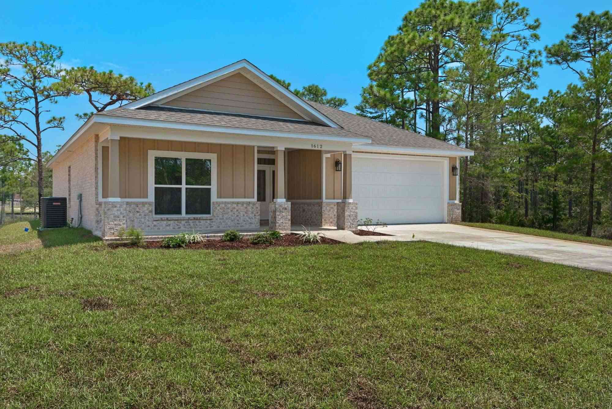 wide front view of custom home The Poderosa by EZ Modern Homes in Pensacola FL-optimized-optimized-optimized