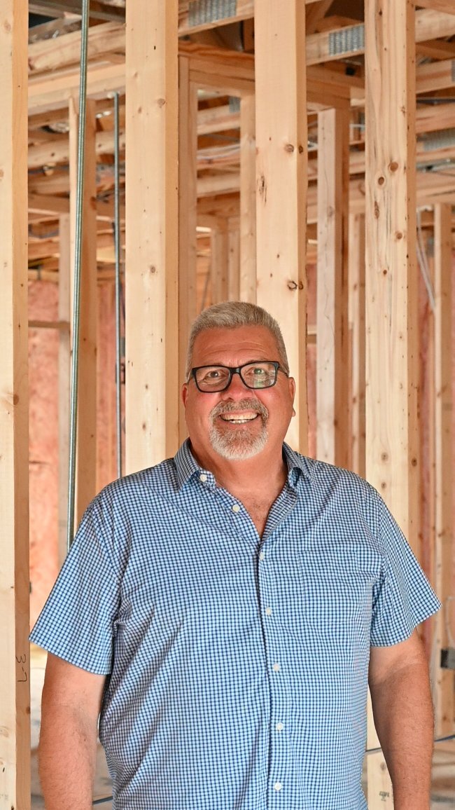 Jim Beran construction professional inside custom home framing by EZ Modern Homes Pensacola FL-optimized