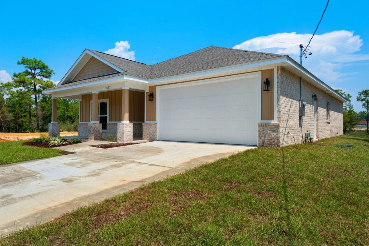 angled view of custom home exterior The Poderosa by EZ Modern Homes in Pensacola FL-optimized-optimized