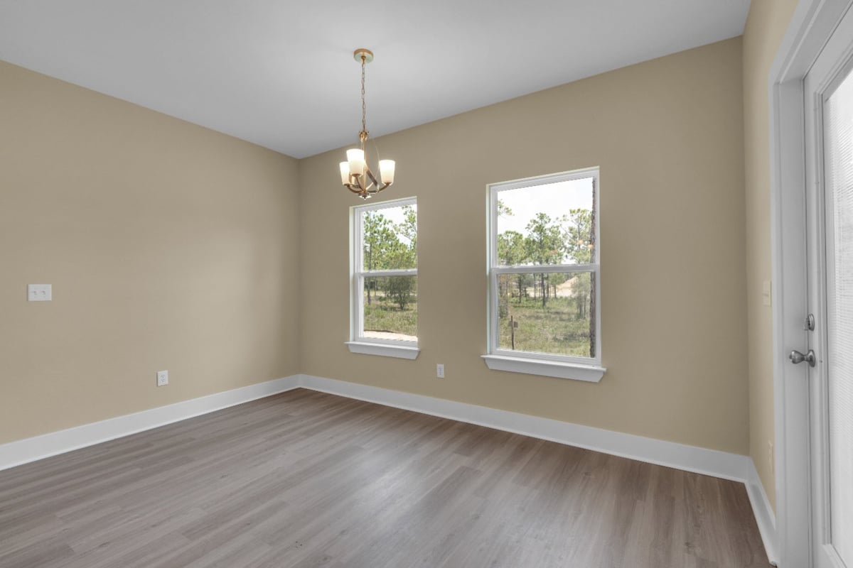 dining area with windows in custom home The Poderosa by EZ Modern Homes Pensacola FL-optimized