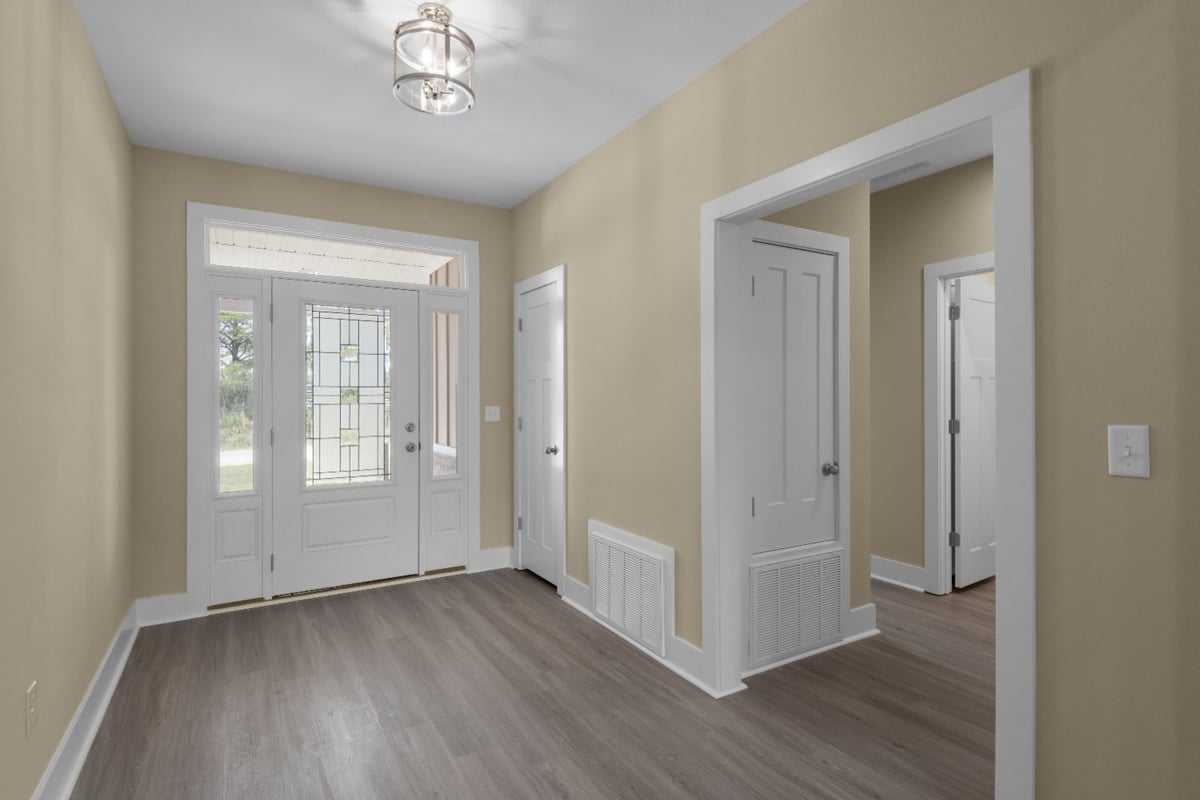 foyer and front entry of custom home The Poderosa by EZ Modern Homes in Pensacola FL-optimized