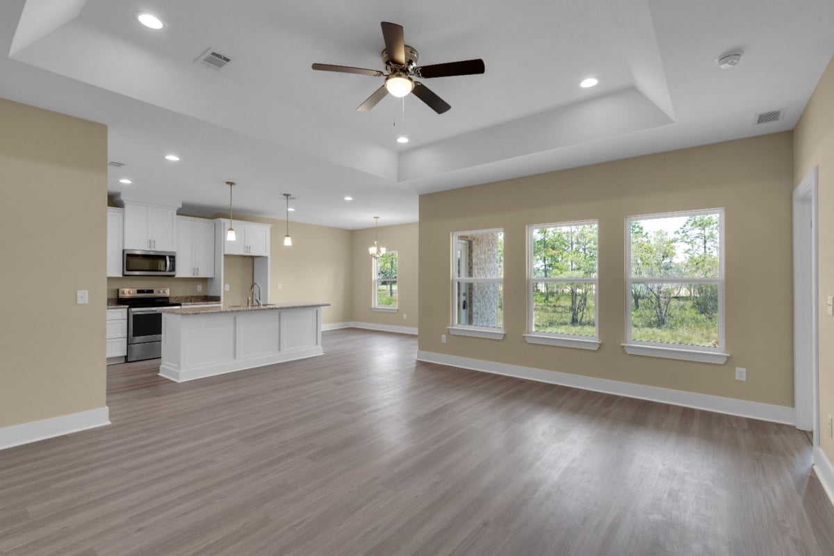living area facing kitchen in custom home The Poderosa by EZ Modern Homes Pensacola FL-optimized