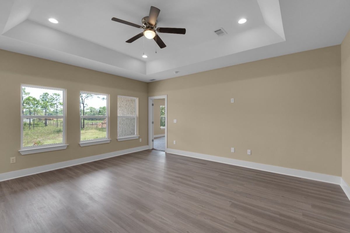 living room interior with windows in custom home The Poderosa by EZ Modern Homes Pensacola FL-optimized