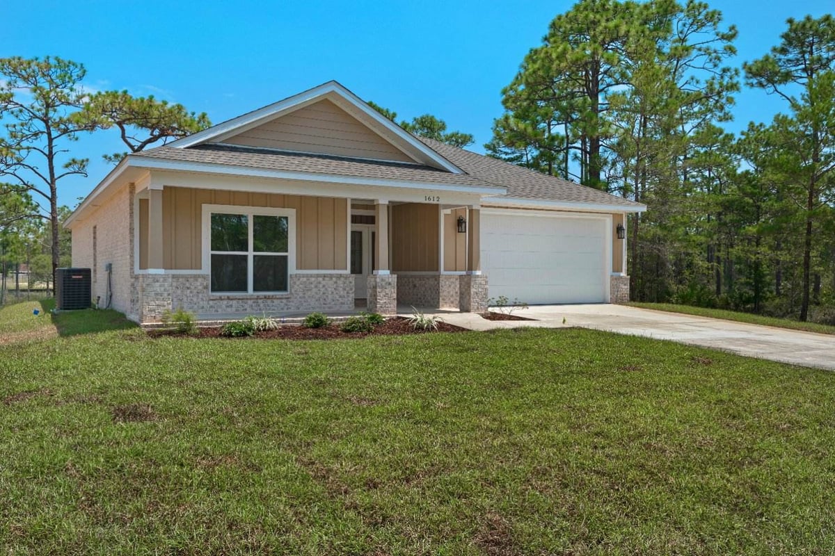 wide front view of custom home The Poderosa by EZ Modern Homes in Pensacola FL-optimized-optimized