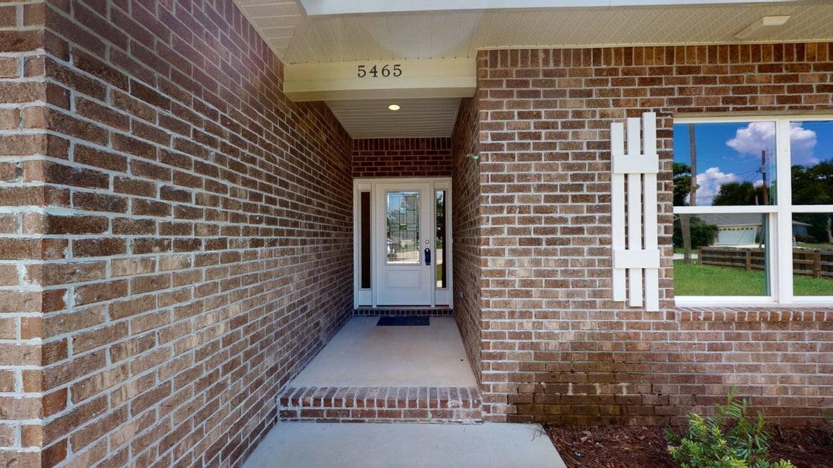 Close-up of The Abilene custom home entryway in Pensacola, FL by EZ Modern Homes featuring modern door and trim.-optimized-optimized