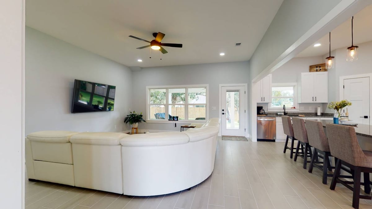 Open concept living room and kitchen in EZ Modern Homes The Lafon custom home in Pensacola, FL-optimized