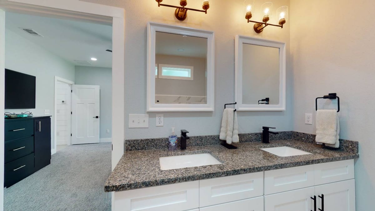 double vanity bathroom with granite countertops and modern fixtures by EZ Modern Homes custom home in Pensacola FL The Lafon-optimized