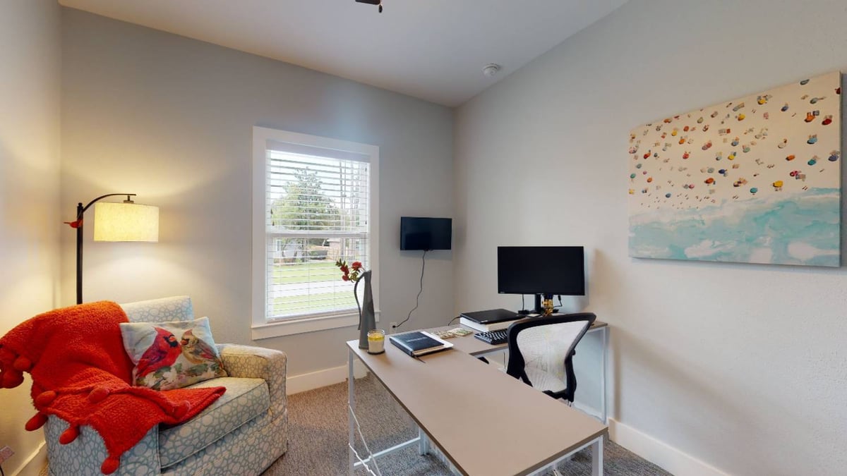 home office space with desk and chair by EZ Modern Homes custom home in Pensacola FL The Lafon-optimized