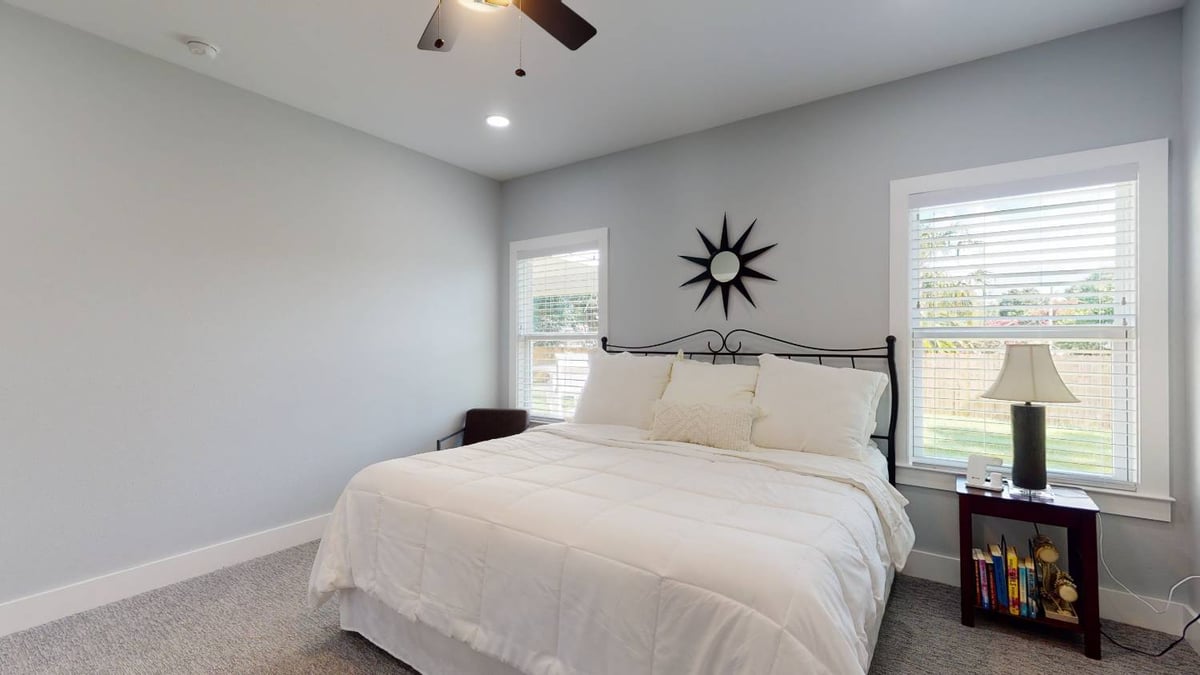 modern bedroom design with natural light in The Lafon custom home by EZ Modern Homes in Pensacola, FL-optimized