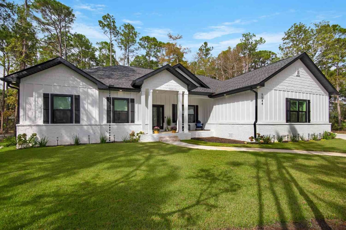 close view of custom home front porch with columns and seating by EZ Modern Homes Pensacola FL The Lafon-optimized-optimized