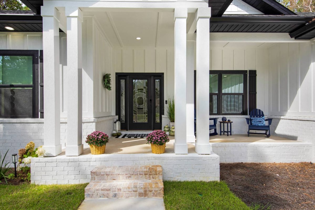 covered front porch with columns and modern entry door by EZ Modern Homes Pensacola FL The Lafon-optimized