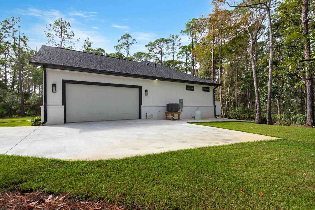 detached garage exterior with driveway in custom home by EZ Modern Homes Pensacola, FL The Lafon-optimized-optimized