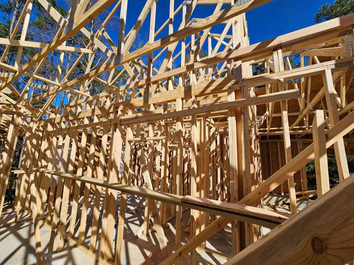 expansive interior framing and roof structure of EZ Modern Homes custom home Pensacola FL The Lafon-optimized-optimized