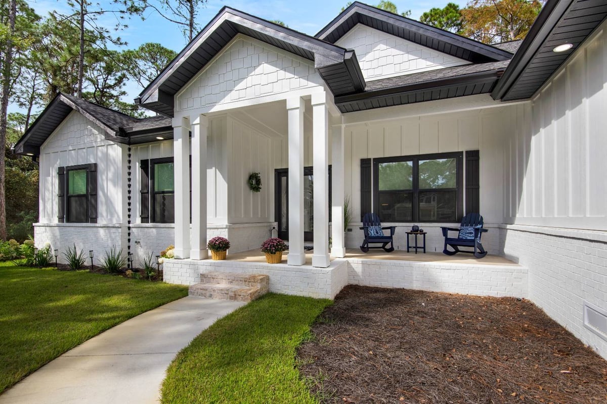 front entry porch with columns and outdoor seating by EZ Modern Homes in Pensacola FL The Lafon-optimized