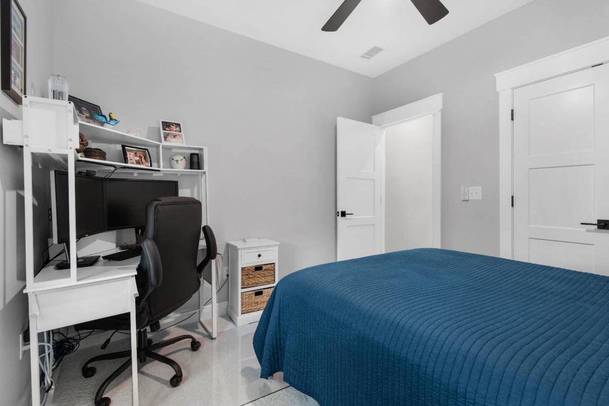 modern bedroom with home office setup in custom home by EZ Modern Homes in Pensacola, FL The Lafon-optimized