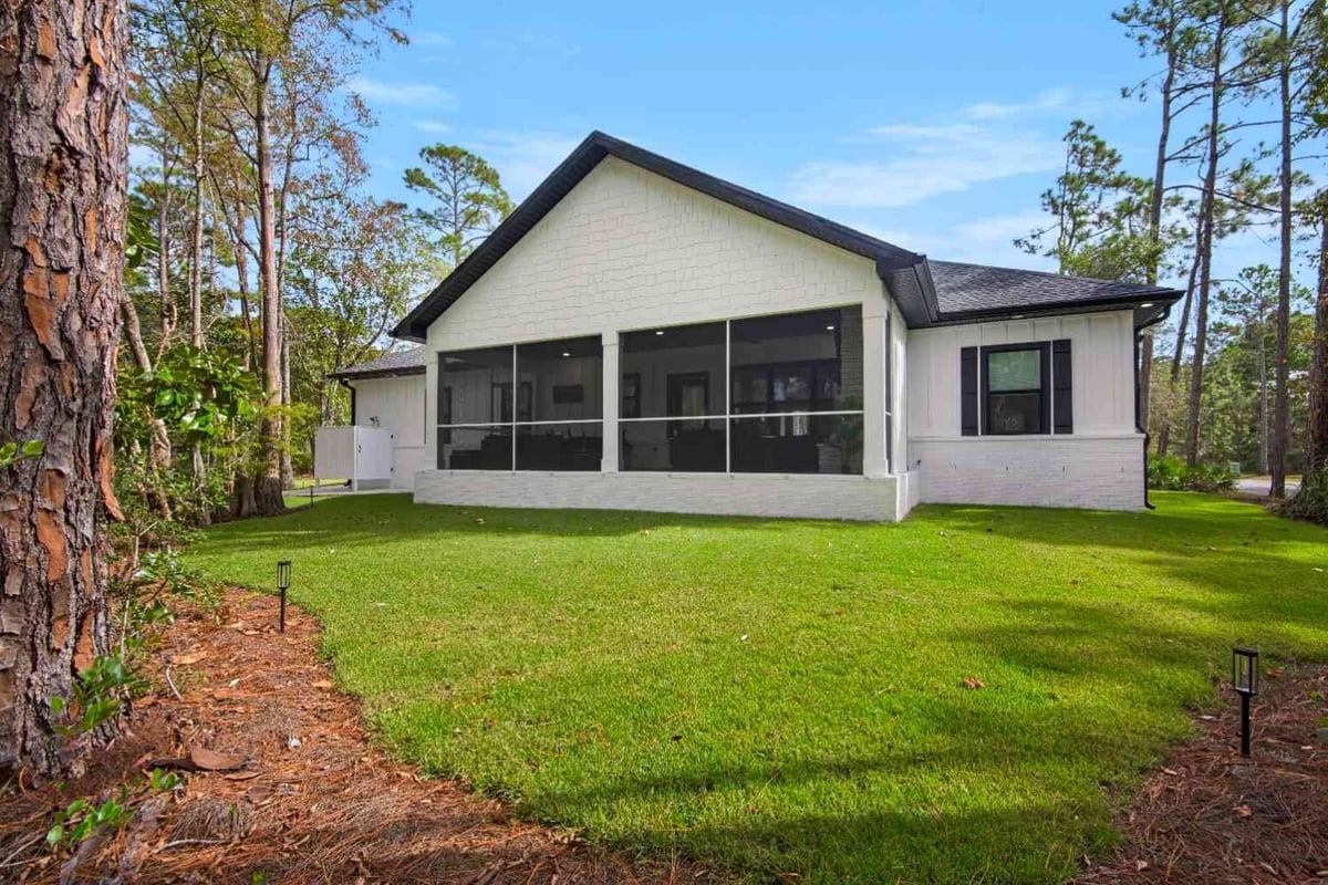 rear exterior with screened porch in custom home by EZ Modern Homes Pensacola, FL The Lafon-optimized-optimized