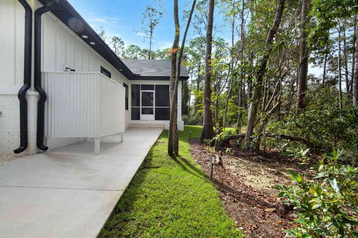 side exterior walkway and screened porch entrance in custom home by EZ Modern Homes Pensacola, FL The Lafon-optimized-optimized