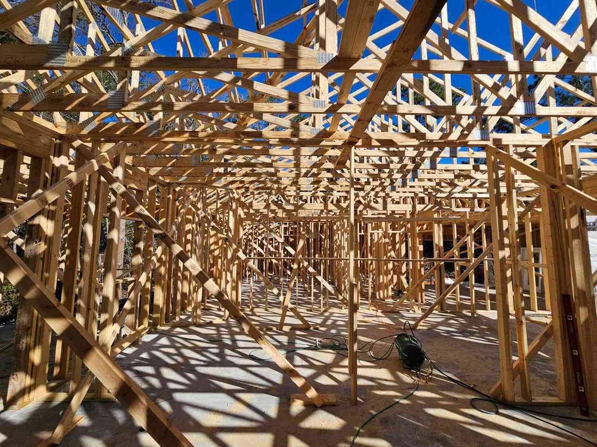 wide shot of structural framing in custom home build Pensacola FL by EZ Modern Homes The Lafon-optimized-optimized