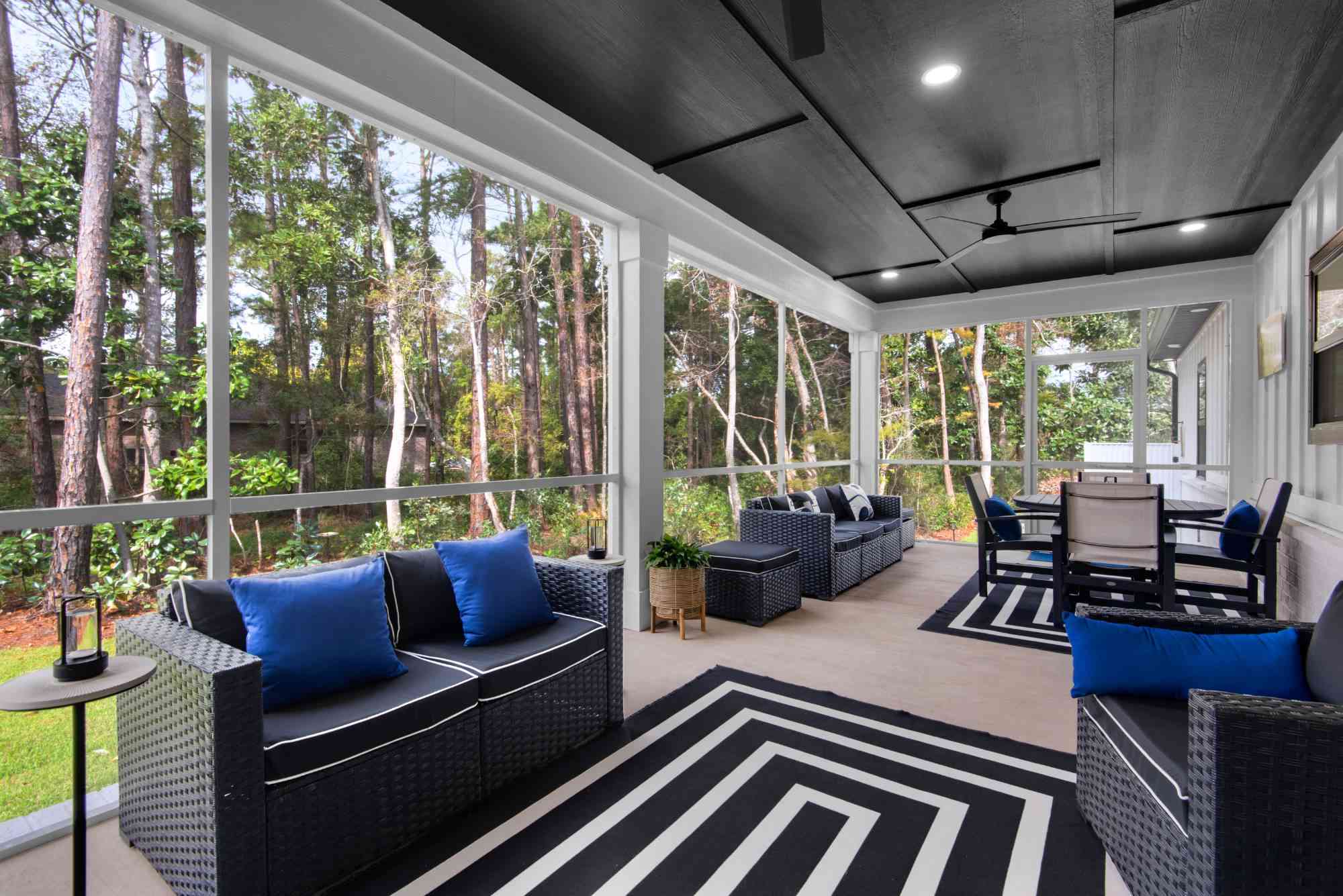 spacious screened porch with seating and forest views in custom home by EZ Modern Homes Pensacola, FL The Lafon-optimized-optimized
