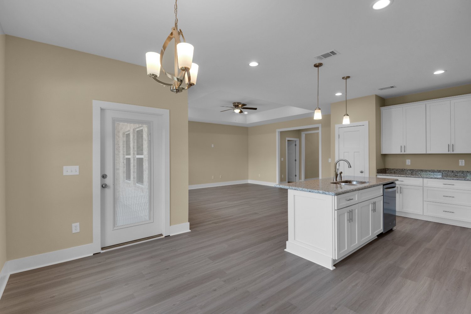 dining area with chandelier in custom home The Poderosa by EZ Modern Homes Pensacola FL-optimized