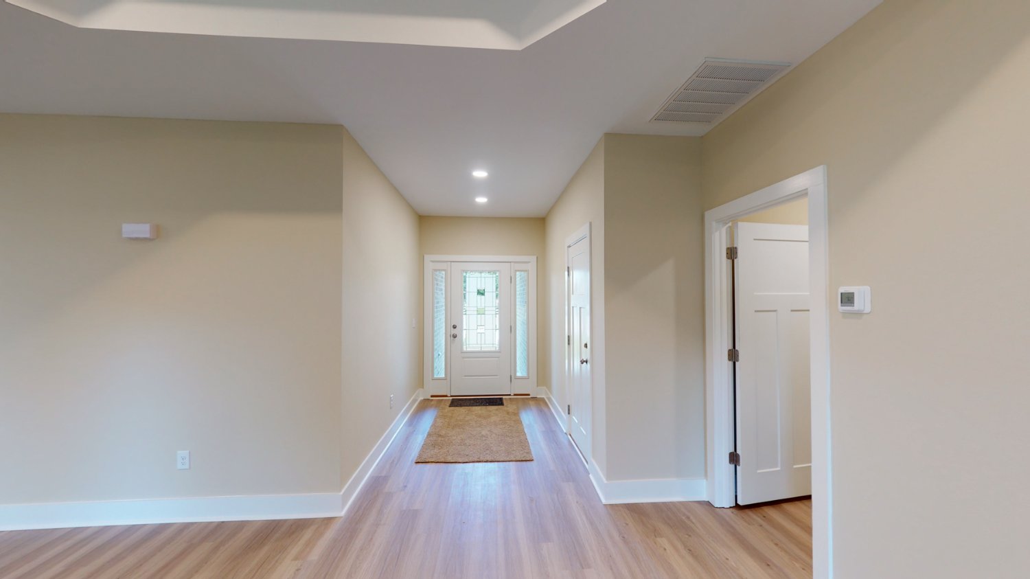 Front entry hallway view inside a custom home by EZ Modern Homes in Pensacola, FL with clean modern design.-optimized