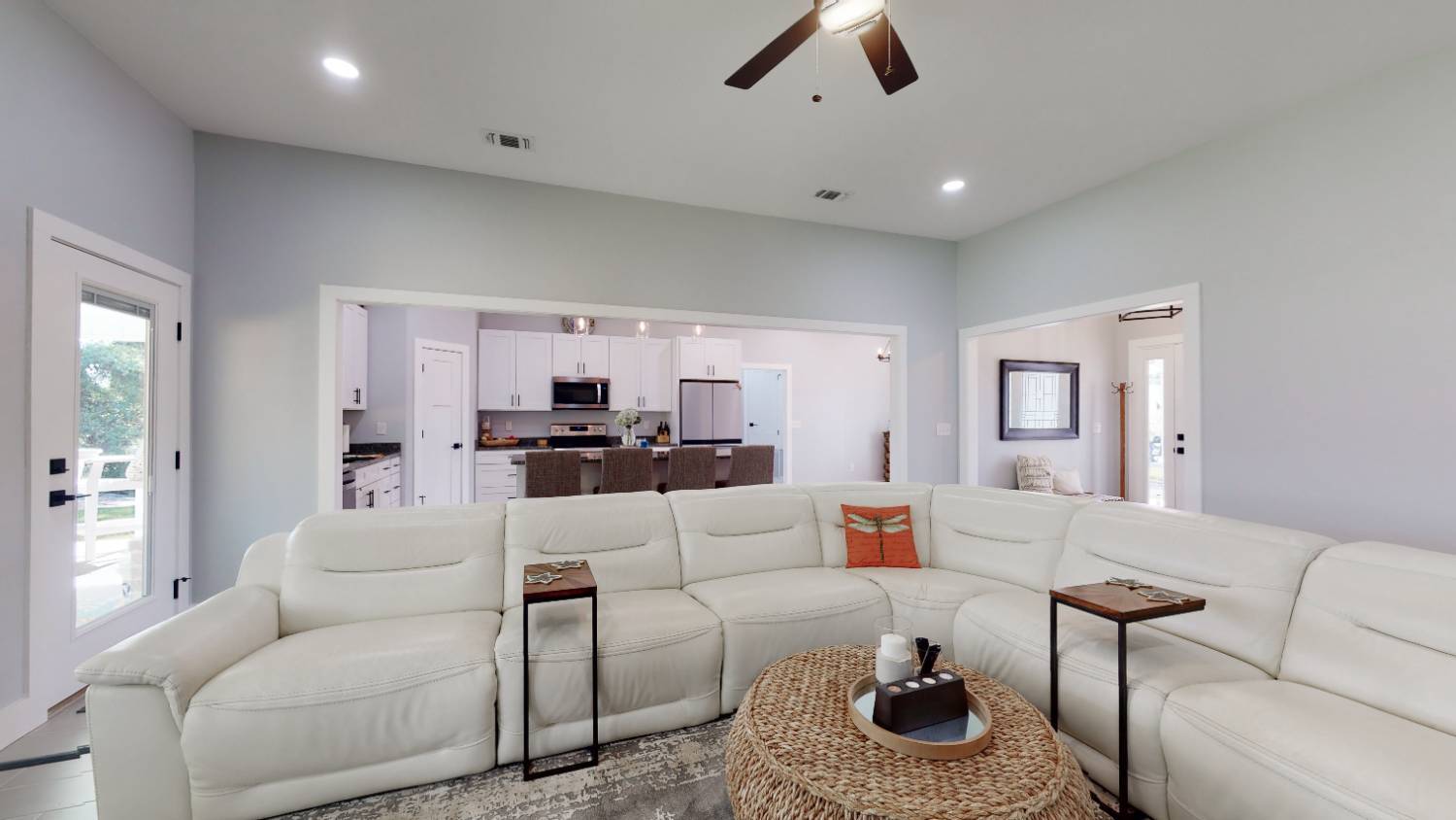 Open living room and kitchen view in EZ Modern Homes The Lafon custom home in Pensacola, FL-optimized