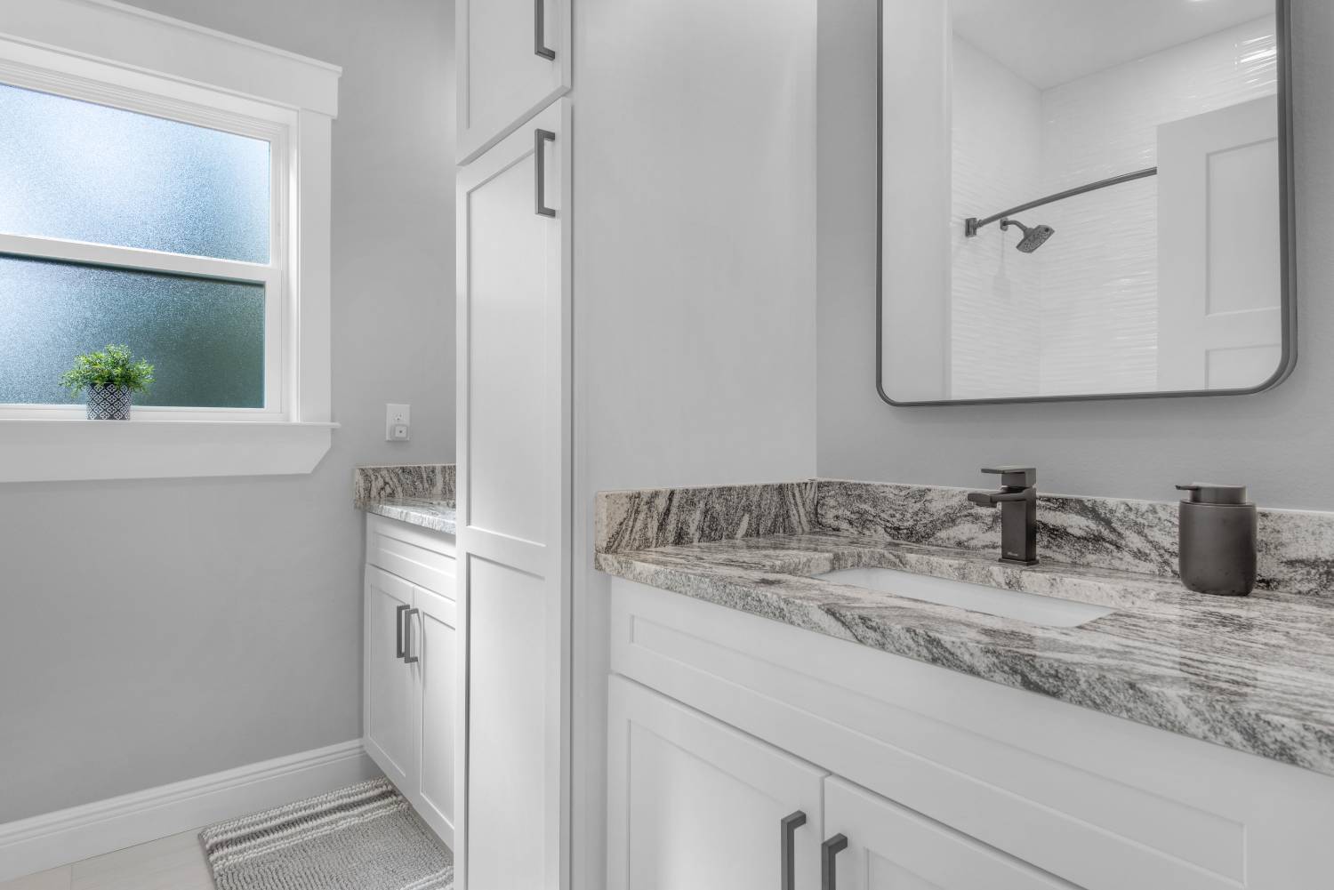 bathroom vanity with granite countertop in Pensacola custom home by EZ Modern Homes The Lafon-optimized