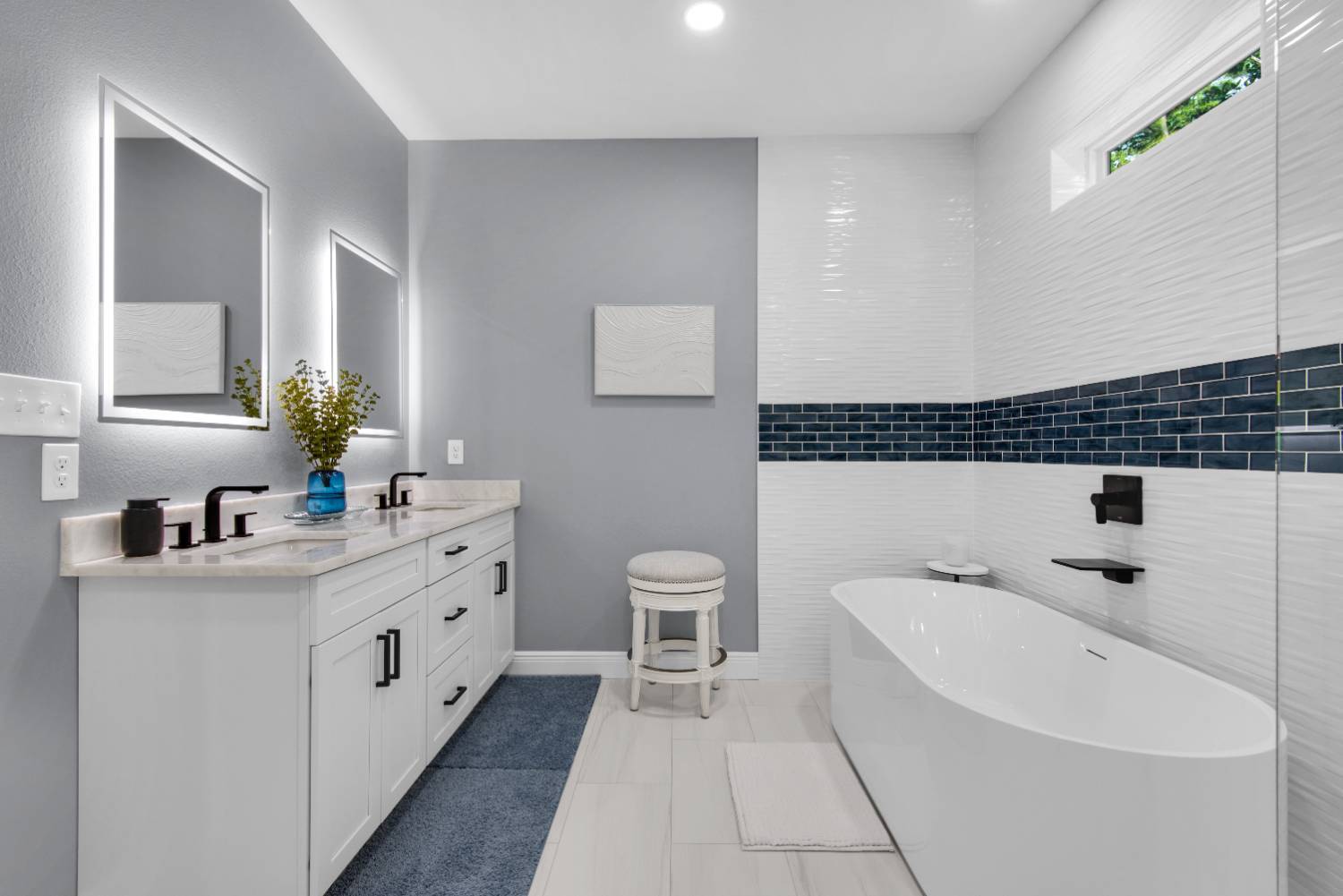 double vanity and soaking tub in modern bathroom by EZ Modern Homes in Pensacola FL custom home The Lafon-optimized