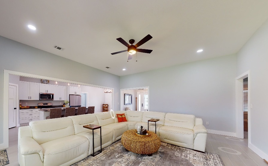 Family touring a move-in ready spec home in Pensacola